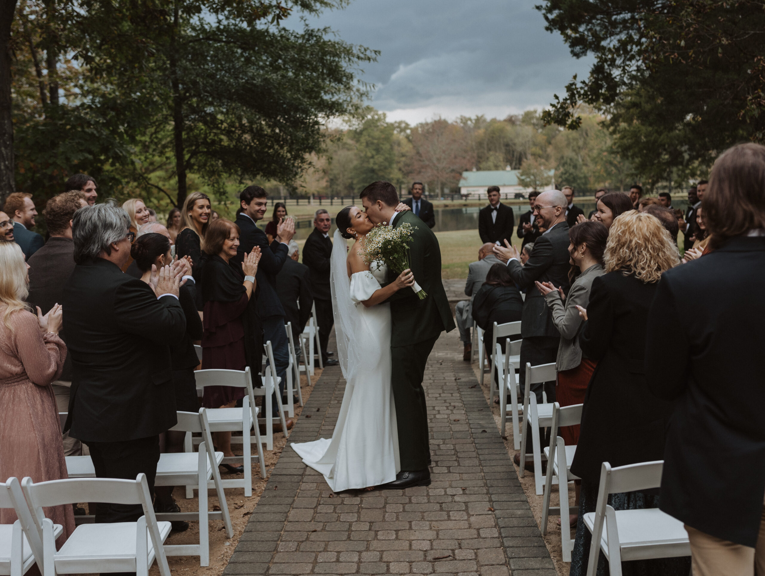 bride and groom at the end of wedding ceremony at morning glory farms in north carolina